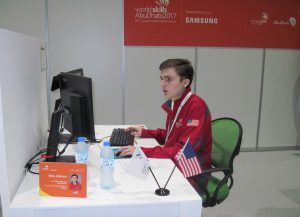 Riley Johnson sitting at his work station while competing at WorldSkills Abu Dhabi in October, 2017